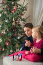 Mother and daughter painting finger nails on xmas day Royalty Free Stock Photo