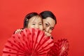 Mother and daughter with paper fans Royalty Free Stock Photo