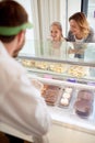 Mother and daughter in pastry shop Royalty Free Stock Photo