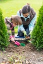 Mother and daughter planting tulip bulbs Royalty Free Stock Photo