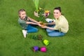 Mother and daughter with plants and flowerpots