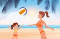 Mother and daughter play ball on tropical beach landscape, healthy fitness on open air