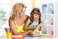 Mother and daughter play doing handcraft Royalty Free Stock Photo