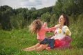 Mother and daughter play in the open air