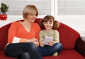 Mother and daughter play with tablet pc