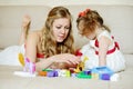 Mother and daughter playing with blocks Royalty Free Stock Photo