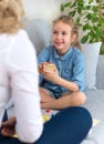 Mother and daughter playing board game.