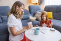Mother and daughter playing card game at home Royalty Free Stock Photo