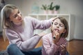 Mother and daughter playing at home. Royalty Free Stock Photo