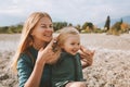 Mother and daughter playing outdoor family lifestyle happy smiling emotions