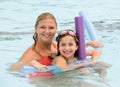 Mother and Daughter Playing in the Pool