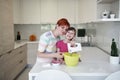 Mother and daughter playing and preparing dough in the kitchen Royalty Free Stock Photo