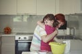 Mother and daughter playing and preparing dough in the kitchen Royalty Free Stock Photo