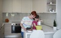 Mother and daughter playing and preparing dough in the kitchen Royalty Free Stock Photo