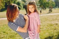 Mother with daughter playing in a summer park Royalty Free Stock Photo