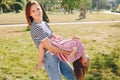 Mother with daughter playing in a summer park Royalty Free Stock Photo