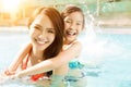 Mother and daughter playing in swimming pool Royalty Free Stock Photo