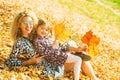 Mother and daughter playing together on autumn walk in nature outdoors. Happy loving family having fun. Mom with child Royalty Free Stock Photo