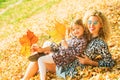 Mother and daughter playing together on autumn walk in nature outdoors. Happy loving family having fun. Mom with child Royalty Free Stock Photo