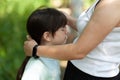 Mother and daughter playing together in the park. Concept of friendly family Royalty Free Stock Photo