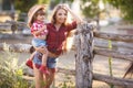 Mother and daughter playing together in the village in the summer.