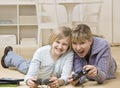 Mother and daughter playing video game