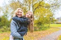 Mother and daughter portrait at park in autumn Royalty Free Stock Photo