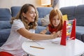 Mother and daughter practicing math using abacus Royalty Free Stock Photo