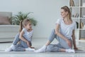 mother and daughter practicing yoga together Royalty Free Stock Photo