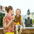 Mother and daughter in Prague viewing photos on camera