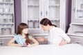 Mother and daughter quarrel because of overuse technology Royalty Free Stock Photo
