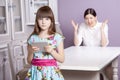 Mother and daughter quarrel because of overuse technology Royalty Free Stock Photo