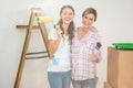 Mother and daughter redecorating a room