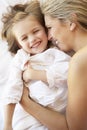 Mother And Daughter Relaxing In Bed Royalty Free Stock Photo