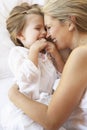 Mother And Daughter Relaxing In Bed Royalty Free Stock Photo