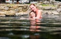 Mother and daughter relaxing in natural thermal water roman spa Royalty Free Stock Photo