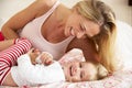 Mother And Daughter Relaxing Together In Bed Royalty Free Stock Photo