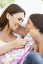 Mother and Daughter relaxing together outisde