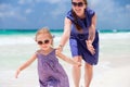 Mother and daughter running at beach Royalty Free Stock Photo