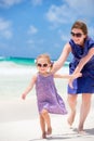 Mother and daughter running at beach Royalty Free Stock Photo