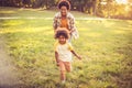 Mother and daughter running trough nature Royalty Free Stock Photo