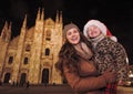 Mother and daughter in Santa Hat near Duomo in Milan, Italy