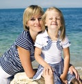 Mother with daughter at sea cost together, happy real family smiling looking to horizont, lifestyle people concept, on Royalty Free Stock Photo