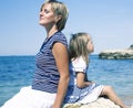 Mother with daughter at sea cost together, happy real family smiling looking to horizont, lifestyle people concept, on Royalty Free Stock Photo