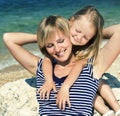 Mother with daughter at sea cost together, happy real family smiling looking to horizont, lifestyle people concept, on Royalty Free Stock Photo