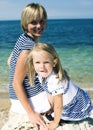 Mother with daughter at sea cost together, happy real family smiling looking to horizont, lifestyle people concept, on Royalty Free Stock Photo