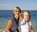 Mother with daughter at sea cost together, happy real family smiling looking to horizont, lifestyle people concept, on Royalty Free Stock Photo