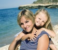 Mother with daughter at sea cost together, happy real family smiling looking to horizont, lifestyle people concept, on Royalty Free Stock Photo