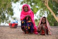 Mother with daughter selling milk