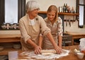 Mother, daughter and senior woman teaching baking, recipe or tips for bonding, love or dinner in kitchen for food Royalty Free Stock Photo